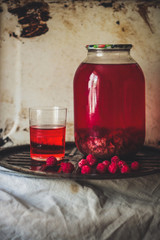 Conserve raspberry drink.