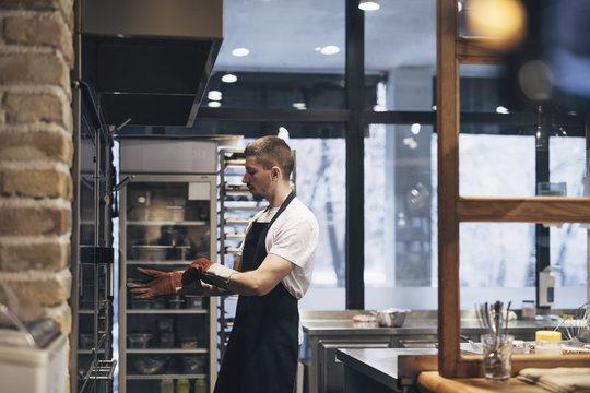 Cook Putting Foof in Oven