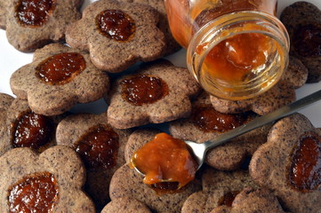 Homemade delicate butter cookies with grated chocolate and apricot jam