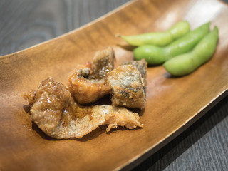 Fish fried and edamame soybean.