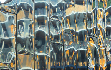 Reflections in shiny panels of a modern building.
