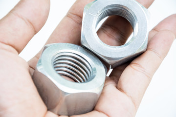 Nut and screw on hand