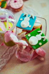 Gingerbreads with glaze rabbits stand on the glass