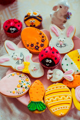 Fototapeta na wymiar Funny gingerbreads in form of rabbits, eggs, carrots and ladybird