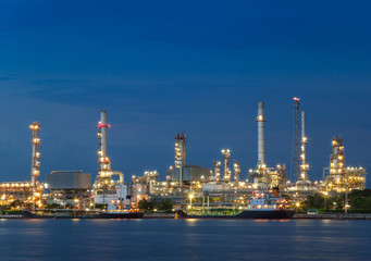 Oil refinery plant industry at dramatic twilight