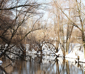 Fototapeta premium Beautiful nature, early spring, river and snow