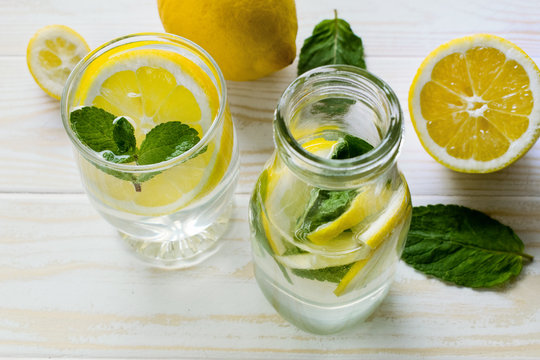 Lemon cocktail with fresh mint on table