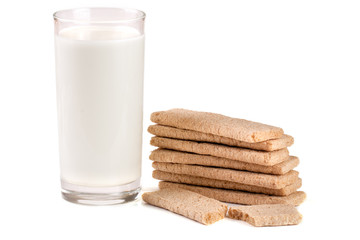 glass of milk with stack of grain crispbreads isolated on white background