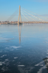 Fototapeta premium River and cable-stayed bridge. Riga, Latvia