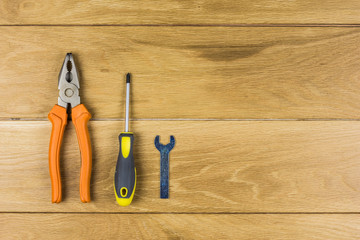 Working tools isolated on a wooden background