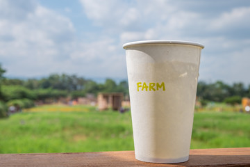 Paper cup with field Background