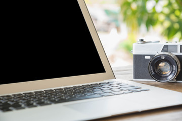 Laptop  on a wooden table outdoors