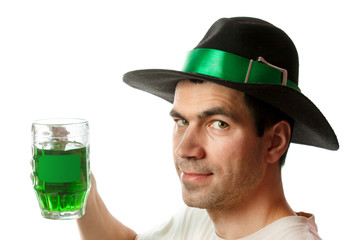 Man in Patrick's Day hat with green drink