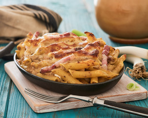 Baked pasta with mushroom sauce and bacon
