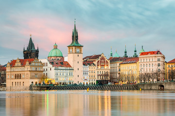 Fototapeta premium The waterfront with Smetana Museum and Charles Bridge in Prague.