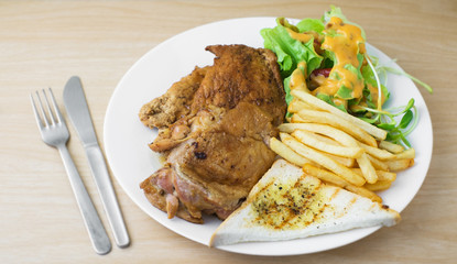 pork and chicken steak with salad and french fried
