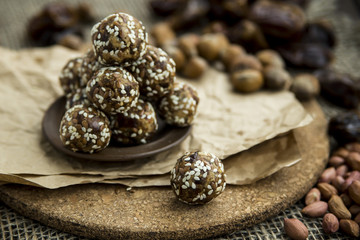 Raw dumplings of dates and nut flour in the crooked and flaxseed