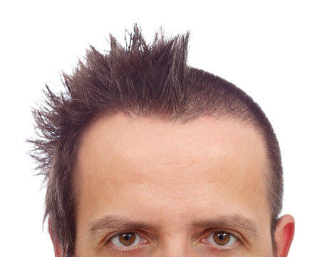 Male upper half face with funny haircut and copyspace on large forehead
