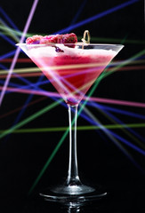 Cocktail in a nightclub with Laser ray