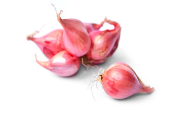 fresh and red shallots isolated on white background