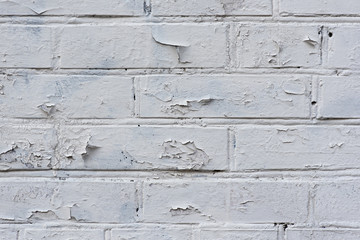 Brick wall with vintage white paint on the top, background, grunge texture