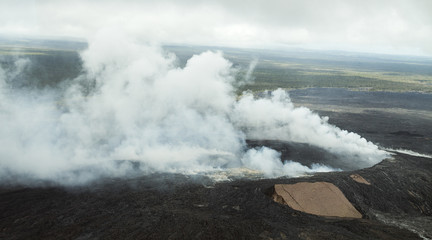 Fototapeta na wymiar Smoking Pu'u O'o crater Hawaii, aerial view