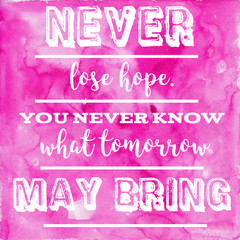Motivating words on pink watercolor background