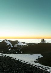 Fototapeta na wymiar Maunakea observatories at dusk with Subaru observatory in distance.