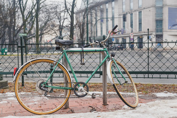 Fototapeta premium Urban green Bicycle parked in the street.