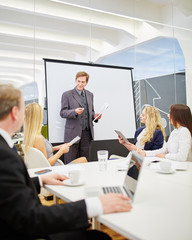 Consultant in a presentation during a business meeting