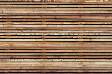 Texture of a modern wooden wall made of slats