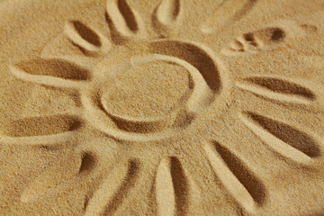 Drawn on sand picture of sun
