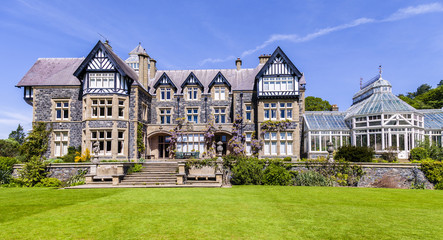 Fototapeta na wymiar Victorian house set in a beautiful garden