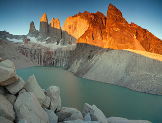 Meeting sunrise at the towers of Torres. National Park Torres del Paine. Patagonia. Chile.