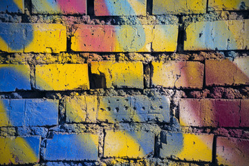 Close-up colorful brick wall background, texture