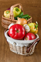 Fresh vegetables and tomatoes in baskets