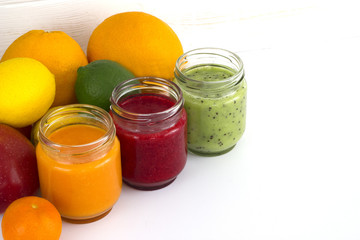 Refreshing fruit smoothie on grey table