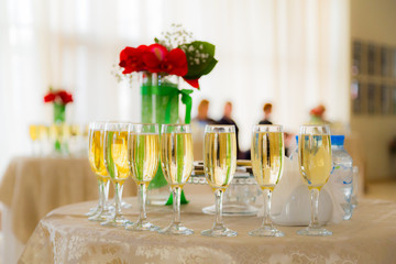 Champagne at the cocktail party. People in the background. Blurred background. Bokeh.
