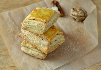 Homemade flaky biscuits with nuts on the baking paper