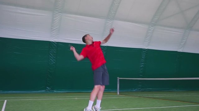 Man standing on tennis court and begins to run