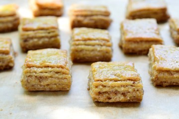 Homemade flaky biscuits with nuts on the baking paper
