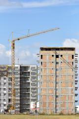 Crane and building construction site