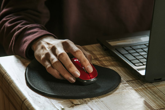 Hand Of Student In The Computer's Mouse