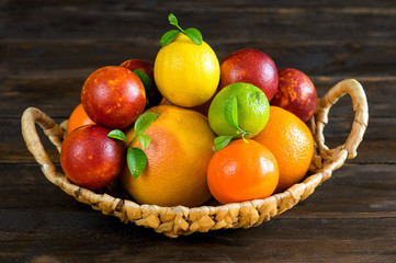 Fruit basket on wooden background