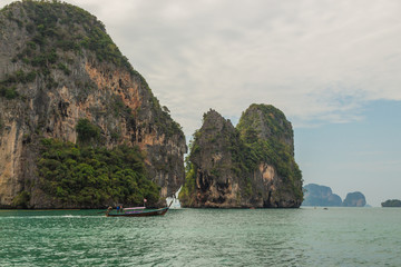 Traditional thai long boat with tourists on the way to Railay beach, near Ao Nang, Krabi province,...