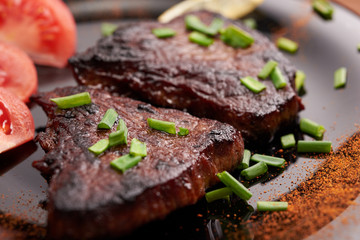 fried steak on a wooden table