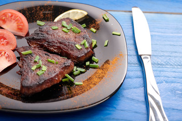 fried steak on a wooden table