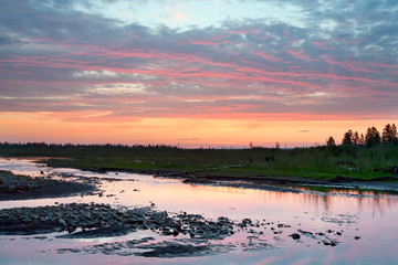 Red clouds over the river. The River Moma. Yakutia. Russia.