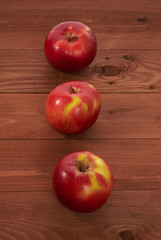 red apples on a wooden table