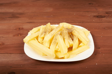 slicing raw potato on the plate